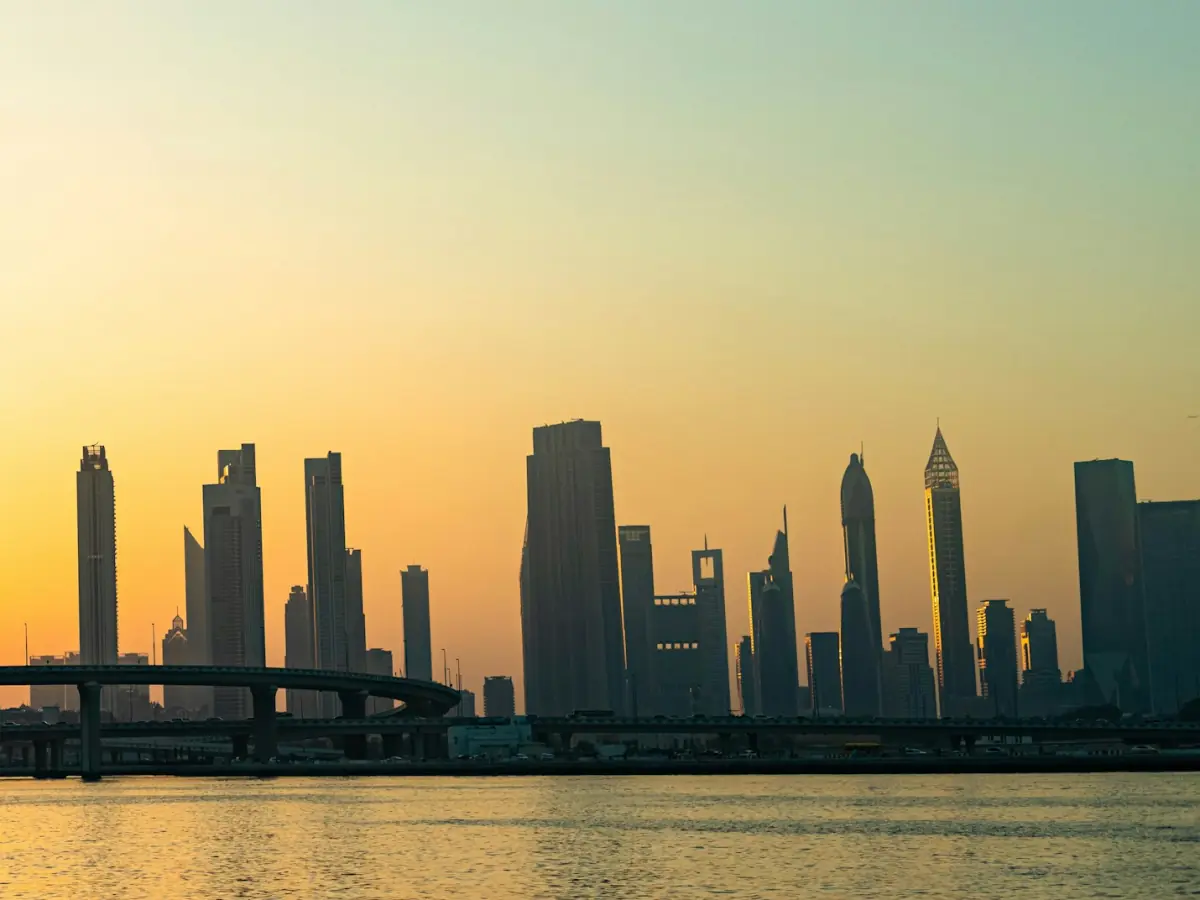 Dubai skyline across the water at sunset