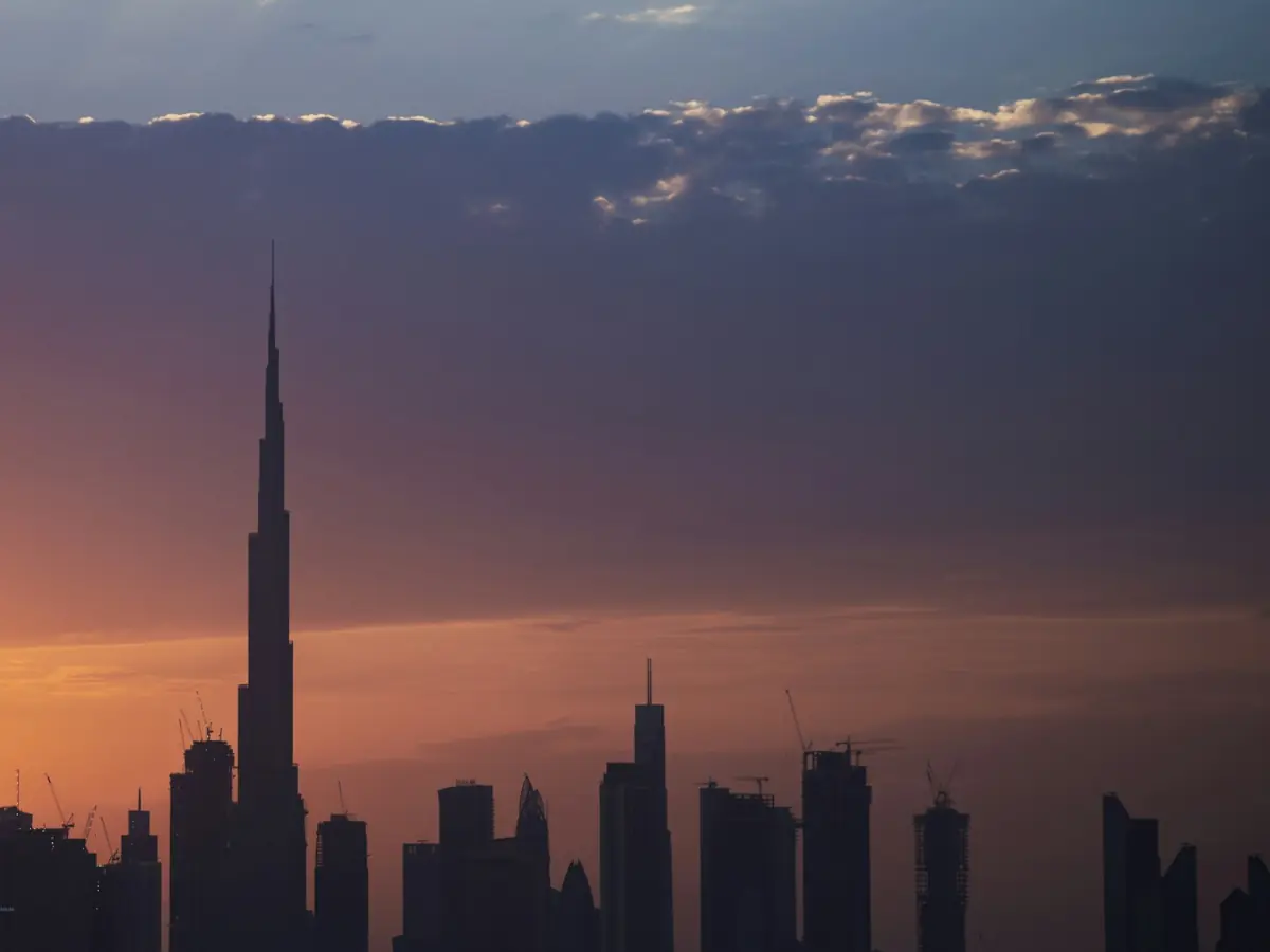 Dubai skyline under evening clouds