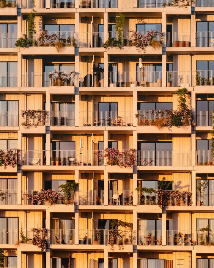 Building facade with balconies in warm light