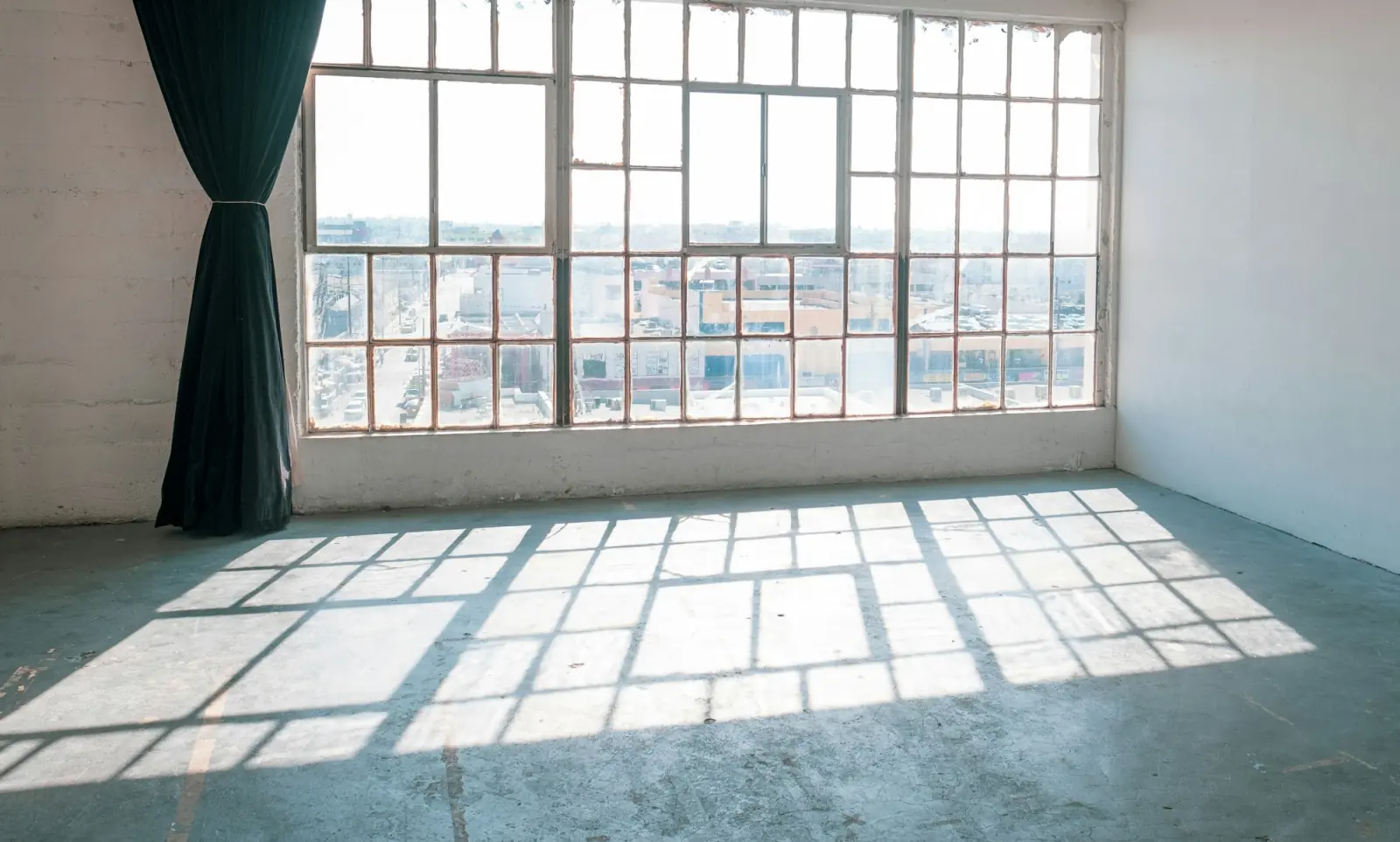 Bright empty office space with large windows