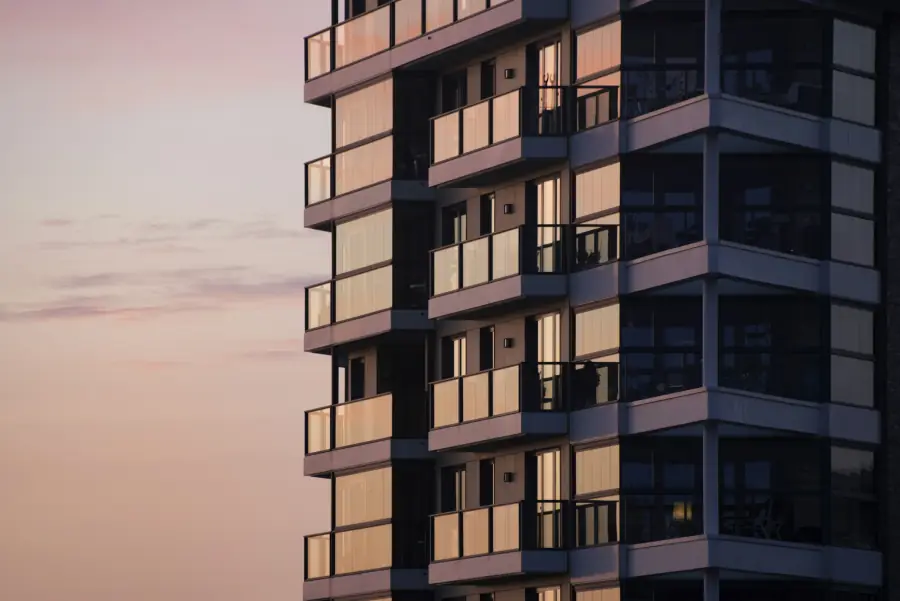 Apartment building with balconies at dusk